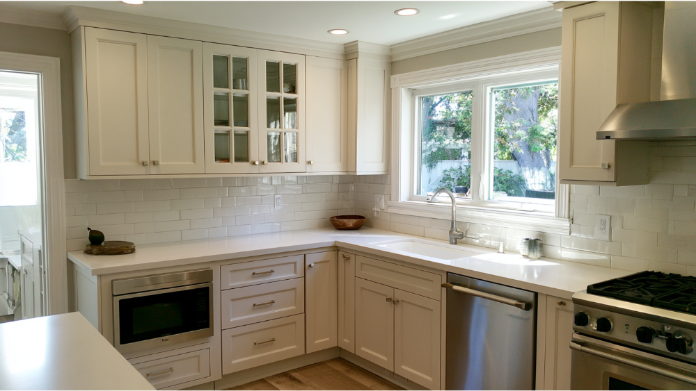 Modern kitchen cabinets with fresh paint, updated hardware, and a clean contemporary finish.