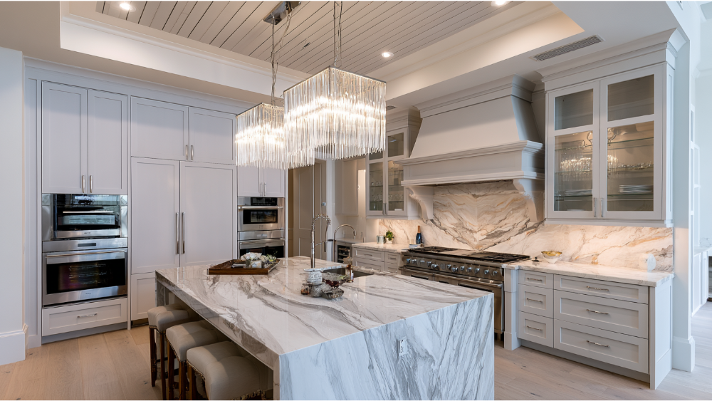 Premium kitchen featuring panel-ready appliances, built-in double ovens, professional range, custom cabinetry, and luxury finishes.